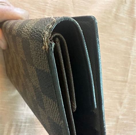 louis vuitton graphite wallet fake|louis vuitton wallet authenticity code.